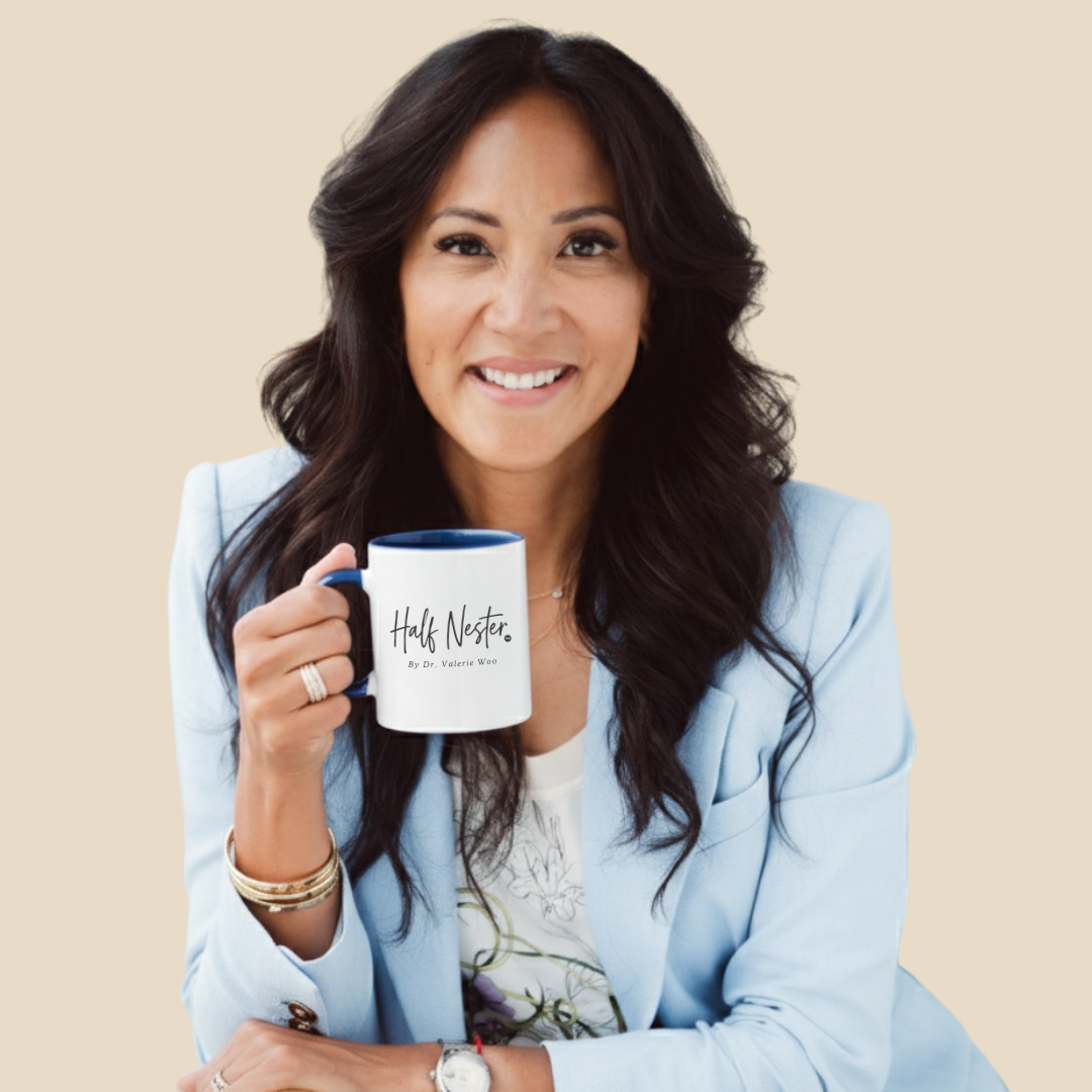 Dr. Valerie Woo holding a Half Nester mug
